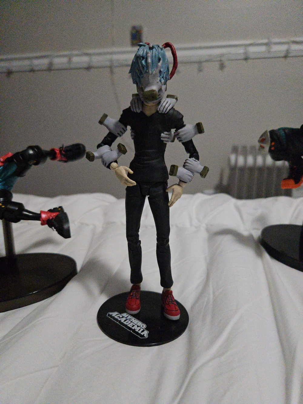 Blue-Haired Multi-Arm Action Figure with Red Shoes
